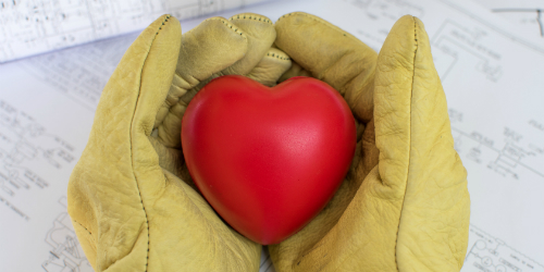 Gloved Hands Holding Red NERF Heart